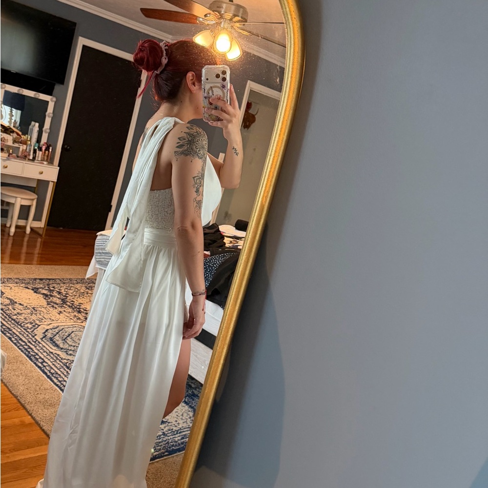 Elegant White Sleeveless Jumper with removable skirt overlay